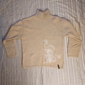ROSSIGNOL France Dragon Cream Turtleneck Sweater